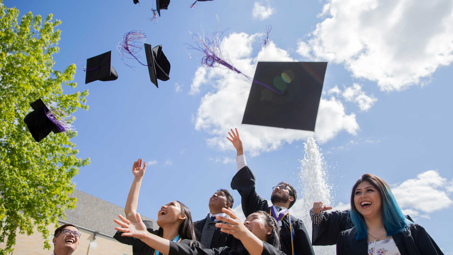 Students celebrating at graduation.